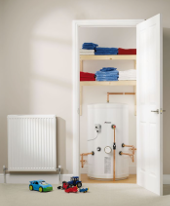 Boiler situated in an airing cupboard photo